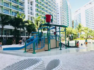 a playground in the middle of a beach at Azure Staycation Near Airport in Manila