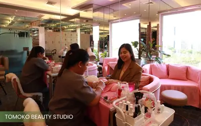 a group of women sitting at a table in a beauty shop at Acacia Hotel Manila in Manila