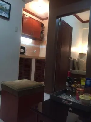 a room with a door and a mirror in a room at Las Pinas Serviced Apartment in Manila