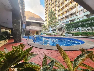 a swimming pool in the middle of a building at SweetSuites at Pine Crest #T3-239 in Manila