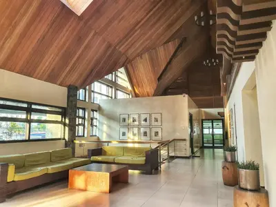 a lobby with couches and a table in a building at SweetSuites at Pine Crest #T3-239 in Manila