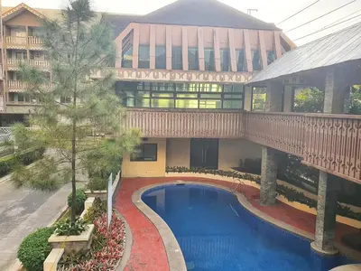an overhead view of a building with a swimming pool at SweetSuites at Pine Crest #T3-239 in Manila