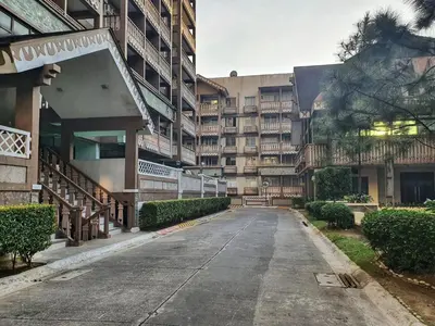 an empty street in front of an apartment building at SweetSuites at Pine Crest #T3-239 in Manila