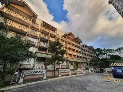 a building with a car parked in front of it at SweetSuites at Pine Crest #T3-239 in Manila