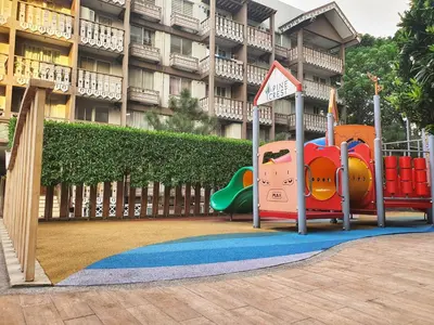 a playground in front of a building at SweetSuites at Pine Crest #T3-239 in Manila