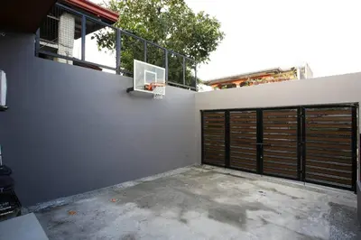 a garage with a basketball hoop on the wall at Addie's Place Soldiers Hills Village Muntinlupa in Manila