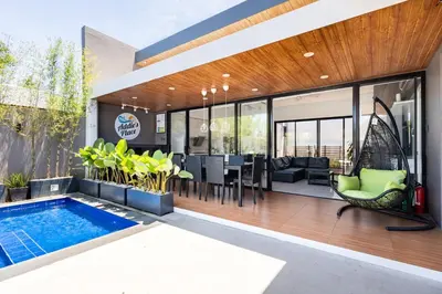 an image of a house with a swimming pool at Addie's Place Soldiers Hills Village Muntinlupa in Manila