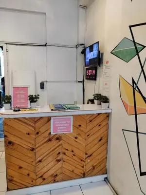 a counter in a room with signs on it at Dormitels.ph Ermita in Manila