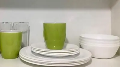 a group of plates and cups on a counter at F-10C Parkside Villas in Manila