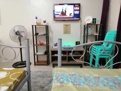 a hospital room with a bed and a tv at Condo Transient Near NAIA Airport-Unlimited Internet v2 in Manila