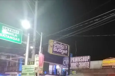a bunch of signs on a street at night at Condo Transient Near NAIA Airport T1234 with Unlimited WIFI v1 in Manila