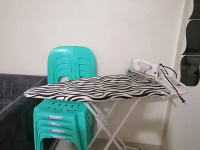 a table with a cloth on top of a chair at Condo Transient Near NAIA Airport T1234 with Unlimited WIFI v1 in Manila