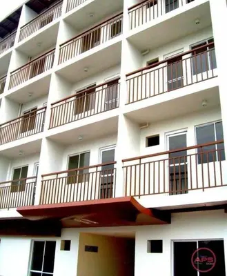 a white building with balconies on the side of it at Condo Transient Near NAIA Airport T1234 with Unlimited WIFI v1 in Manila