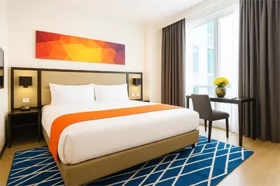 a hotel room with a bed and a desk at Hotel Lucky Chinatown Binondo Manila in Manila