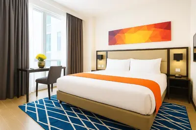 a hotel room with a bed and a desk at Hotel Lucky Chinatown Binondo Manila in Manila