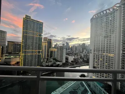 a view of a city skyline with tall buildings at Great 1BR Aqua Livingstone with Netflix, Pool & Gym in Manila