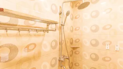 a shower in a bathroom with a shower curtain at RedDoorz Plus at Winter Benitez in Manila
