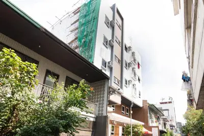 a tall white building on a city street at OYO 152 Sangco Condotel in Manila