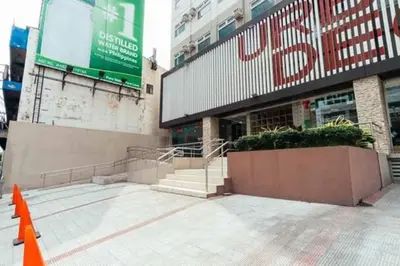 a building with an orange cone in front of it at Urban Deca Tower OYO 3 in Manila