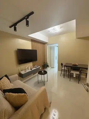 a living room with a couch and a table at AZURE URBAN RESORT RESIDENCE R&C - Parañaque in Manila