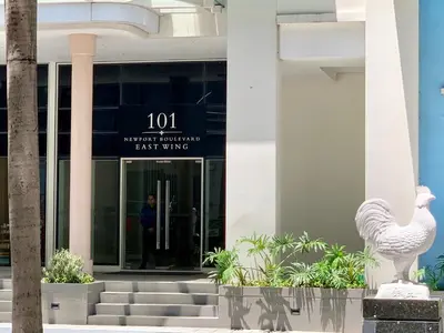 a man standing in the entrance to a building at 101 Newport City Chillax C2 Manila Airport Pasay in Manila