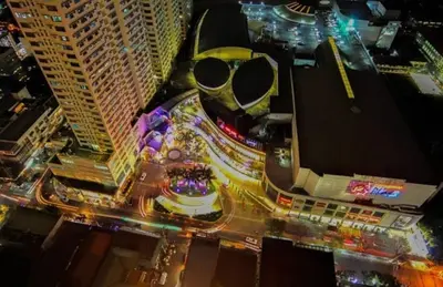 an overhead view of a city at night with traffic at JMM Grand Suites in Manila