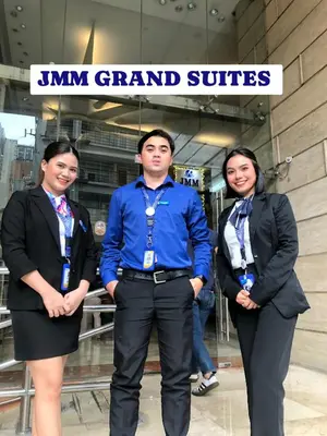 a group of three people standing in front of a store at JMM Grand Suites in Manila