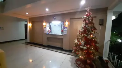 a christmas tree in the lobby of a building at Casa Micarosa Hotel in Manila