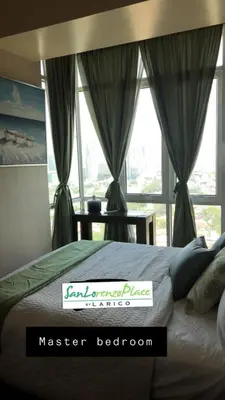 a master bedroom with a bed and a window at SAN LORENZO PLACE 2BR 29-E by LARICO in Manila
