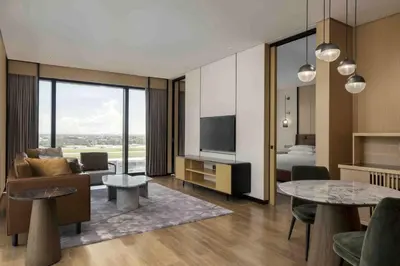 a living room with a couch and a television at Sheraton Manila Hotel at Newport World Resorts in Manila