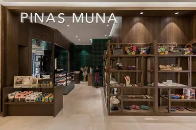 a pimautical store in a shopping mall with shoes on shelves at Sheraton Manila Hotel at Newport World Resorts in Manila
