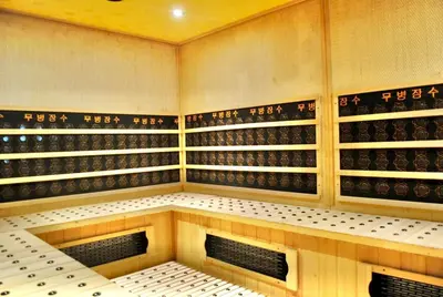 a wine cellar with wine bottles on the wall at Selah Lofts Hotel in Manila