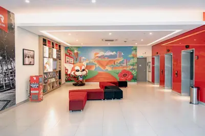 a store hallway with a large mural of a fox at Red Planet BGC The Fort in Manila