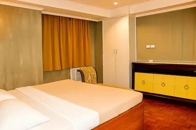 a bedroom with a bed and a mirror at CONNECTOR Hostel in Manila