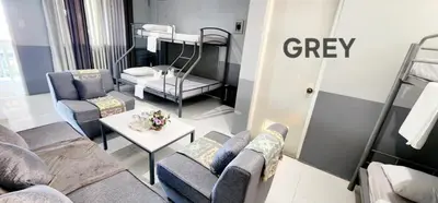 a living room with a couch and a bunk bed at ROCCA Del GARDA Residences in Binangonan