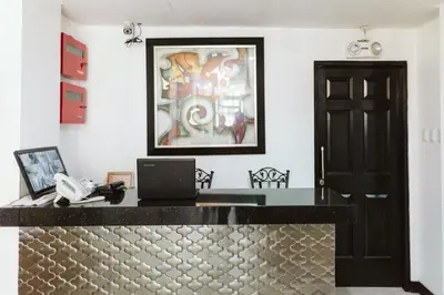a office with a desk with a laptop on it at San Agustin Residences in Manila