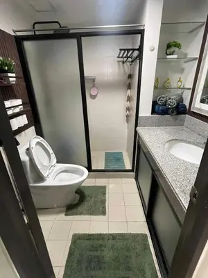a bathroom with a toilet and a sink at MaRoy Suites at Asteria Residences (Near NAIA with free Parking+Fiber Internet) in Manila