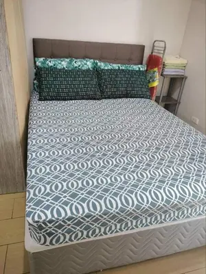 a bed in a room with a bed sidx sidx sidx at Cubao ManhattanHeights Unit 7EF Tower B, 1BR in Manila