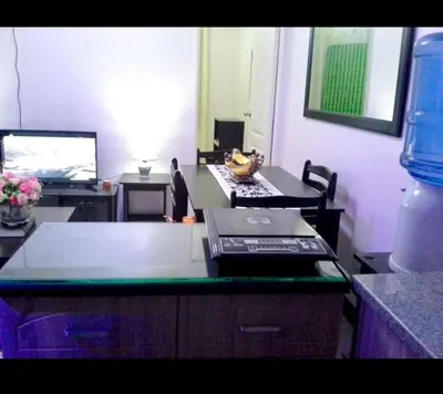 an office with a desk with a laptop and a computer at Estien’s Cozy Condotel to Stay in Imus