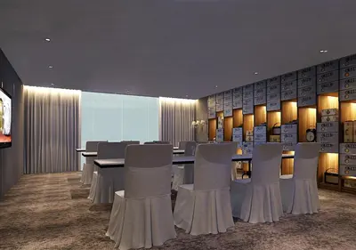 a conference room with a long table and chairs at Brittany Hotel BGC in Manila