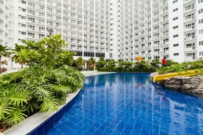 a large swimming pool in the middle of a building at Luxury condo At Shore 1 Tower C1, Mall of Asia Complex Pasay City in Manila