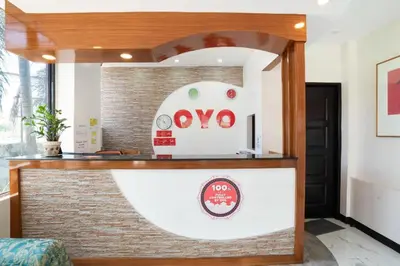 a counter with a omo sign on a brick wall at OYO 195 Ranchotel - Biñan in Biñan