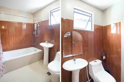 a bathroom with a sink and a toilet and a tub at OYO 195 Ranchotel - Biñan in Biñan