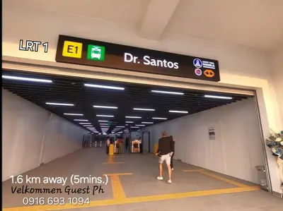 a man walking through a tunnel at an airport at NAIA Airport Fasanvej Studio condo NetflixTv 4pax in Manila