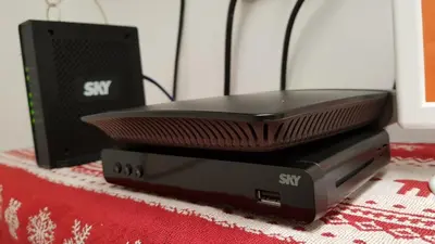 a laptop computer sitting on top of a pile of servers at Crossroads Hostel Manila in Manila