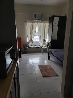 a small room with a bed and a window at Cozy Studio @ One Capitol Condo 2nd St. Kapitolyo in Manila
