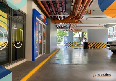 a hallway of a building with a parking lot at The City Flats Amorsolo in Manila
