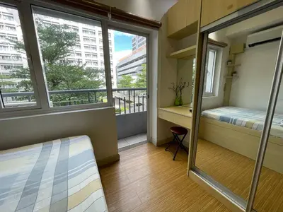a small room with a bed and a window at SMDC GRACE RESIDENCIES in Manila