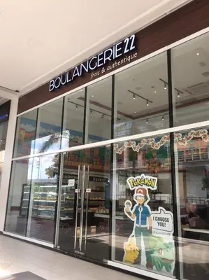 a store front of a building with a toy in the window at Condo 101 Newport in Manila