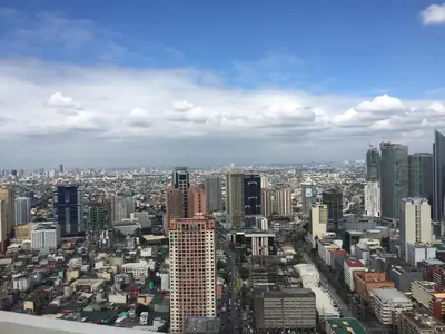 a view of a city with many tall buildings at The Beacon 1BR for 4, T2, WIFI 300Mbps in Manila